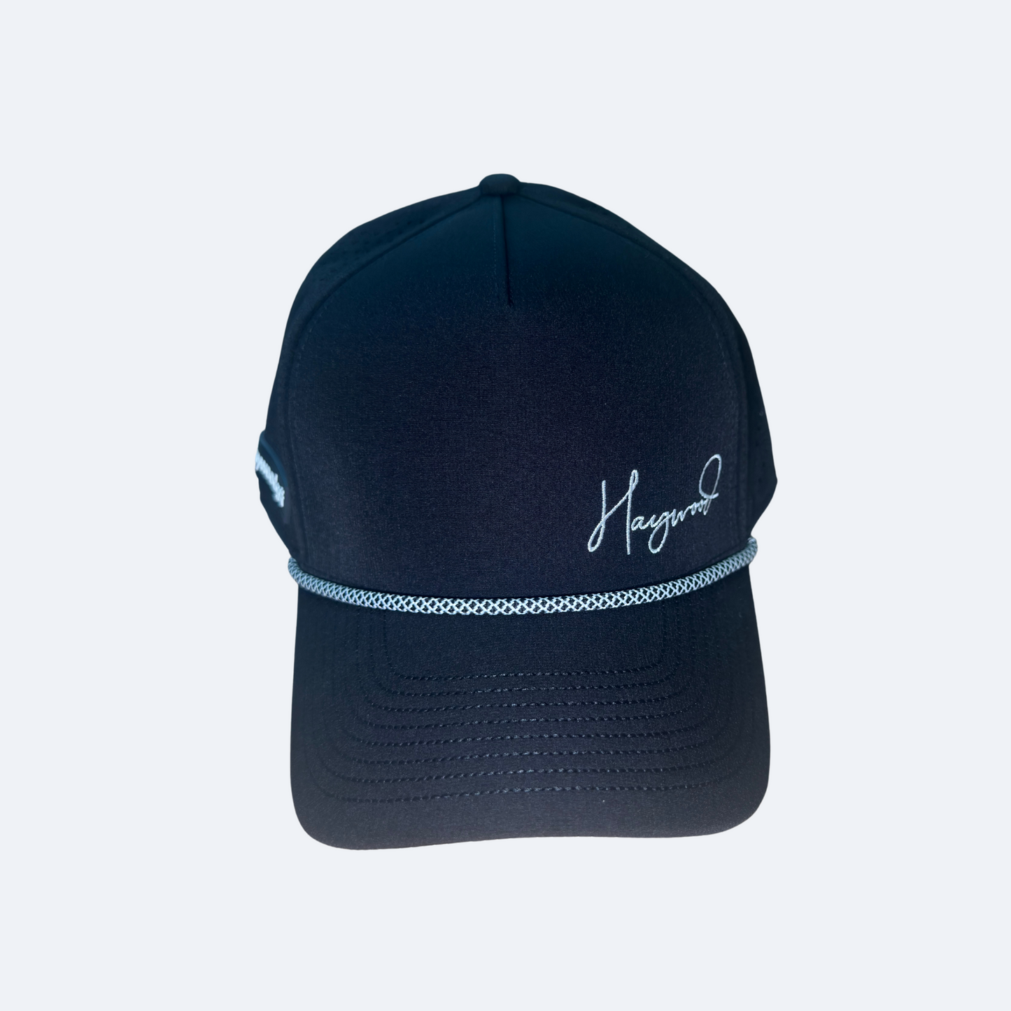 black cap with white embroidery on a light gray background