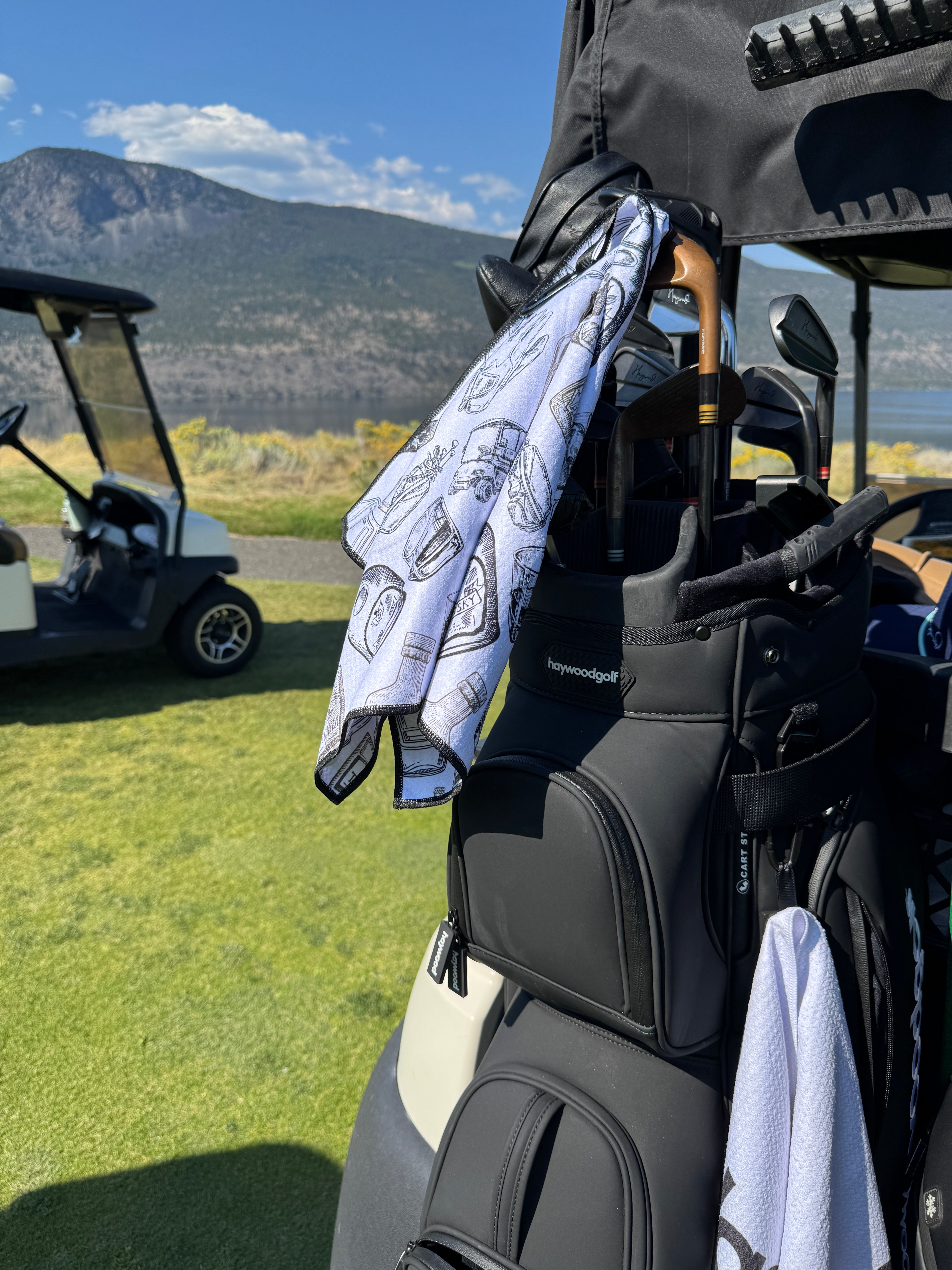 Player using Magnetic Golf Towel